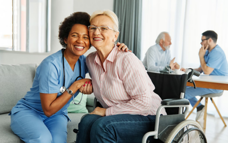 A senior male hospice medical director in a white lab coat speaking with a nurse and caregiver, representing clinical leadership in Dallas-Fort Worth hospice care.